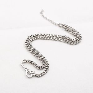 Silver curb chain necklace with a cursive lucky pendant and adjustable lobster clasp