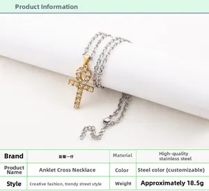 Detailed macro view of an Ankh cross pendant with gold plating and cubic zirconia inlay