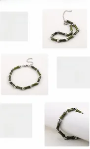 Detail of green bamboo style beads and polished stainless steel beads on the bracelet