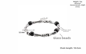 Detailed close-up of stainless steel bamboo tube and black glass beads bracelet with clasp