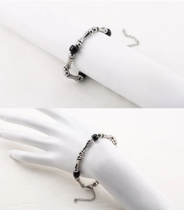 Close-up of titanium steel bamboo link bracelet with black beads and adjustable clasp
