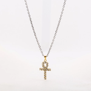 Golden Ankh cross pendant with sparkling crystals on a slim silver-tone O-chain necklace
