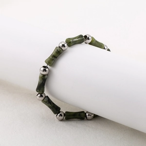 Men's minimalist stainless steel bracelet with green bamboo-shaped beads and polished silver beads