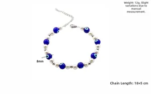 Detail showing 8mm evil eye beads with pearls and dimensions of 18+5cm on a white surface