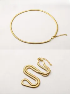 Detailed view of 5mm gold plated flat snake chain with lobster clasp and adjustable tail