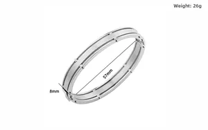 Detail of silver titanium steel bracelet showing 8mm width and brushed metal texture