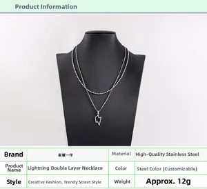 Detailed close-up showing the double-layer steel necklace with lightning bolt pendant
