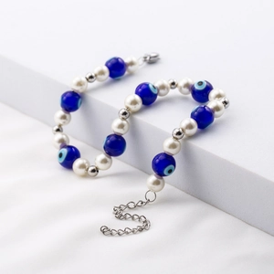 Titanium steel evil eye bracelet with white pearls and adjustable chain for unisex