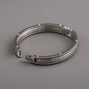 Men's titanium steel geometric oval bracelet with brushed metal finish and clasp