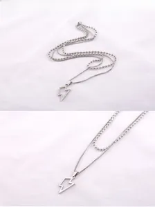Detailed view of silver double-layer lightning pendant necklace with bead and box chains