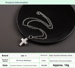Detail showing high-quality polished stainless steel hollow cross pendant on a link chain