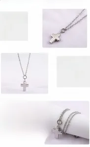 Detail of 360-degree mirror polished silver stainless steel hollow cross pendant necklace