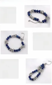 Macro shot of stainless steel chain links and blue beads on a men's hip-hop style bracelet