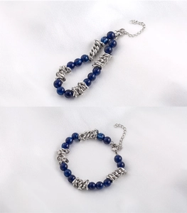 Detail view of blue stone beads with stainless steel chain and secure lobster clasp closure
