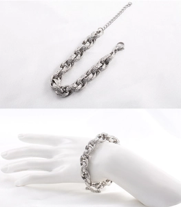 Detail of chunky stainless steel O-chain bracelet with embossed mesh texture and lobster clasp