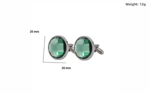 Macro detail of 20mm round silver cufflinks with emerald green faceted crystal stone