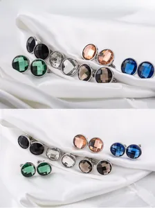 Macro shot of 2cm round crystal cufflinks with faceted cuts in multiple vibrant colors