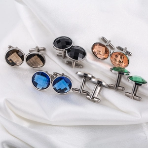Five pairs of round crystal cufflinks in assorted colors with silver stainless steel base