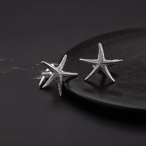 Polished silver starfish cufflinks for men featuring a realistic 3D ocean texture