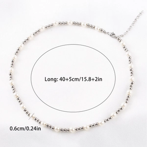 Detail of faux pearl and silver metal bead choker necklace with lobster clasp