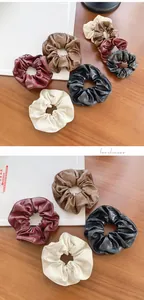 Detailed close-up of premium PU leather scrunchies in burgundy, coffee, beige, and black