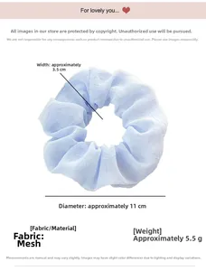 Detail of light blue chiffon scrunchie showing 11cm diameter and sheer fabric texture