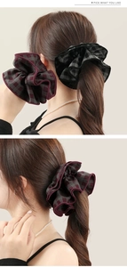 Detail of oversized retro plaid scrunchies with elegant double-layer ruffled fabric texture