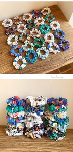 Close-up of assorted scrunchies with football and sports patterns on a wooden surface