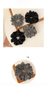 Detail showing set of four sparkling dark grey and black hair scrunchies with silver dots