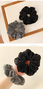 Detail of elegant black rhinestone and grey striped elastic hair scrunchies set