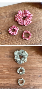 Detailed comparison of striped fabric scrunchies in red and green in three sizes