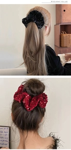 Detail of oversized velvet scrunchies with shiny sequins for low ponytails and buns