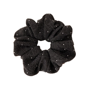 Sparkling black fabric scrunchie with silver glitter accents and high elasticity