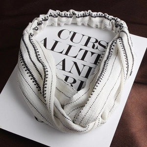 Minimalist white cotton linen headband with black geometric lines and abstract patterns