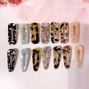 14-piece acetate hair clip set with marble and tortoiseshell patterns in diverse shapes