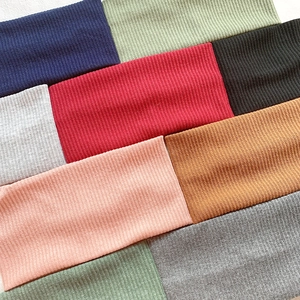 Variety of colorful ribbed knit wide headbands for women in multiple trendy autumn colors