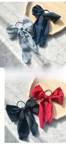 Detail showing chiffon bow hair ties in light blue, navy, black and deep red colors