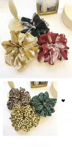Detail of oversized floral and leopard print chiffon scrunchies for vintage hairstyles