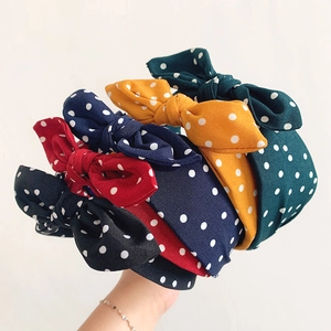 Serre-têtes à pois avec nœuds en cinq couleurs dont noir, rouge, jaune et bleu marine