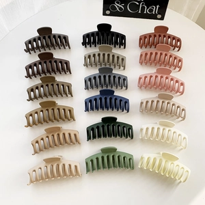 Set of 18 large matte dragon bone hair claws in various Morandi colors on white display