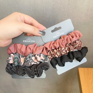 Set of 6 French style silk satin scrunchies with floral and leopard patterns on card