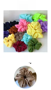 Close-up of oversized organza scrunchies in assorted pastel colors and pleated texture