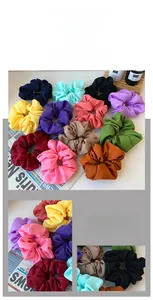 Detail of oversized organza scrunchies showing texture and vibrant color options