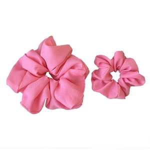 Pink french organza scrunchies set with two oversized chiffon hair ties on white background