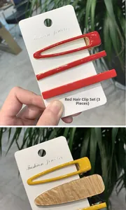 Set di 3 fermagli per capelli colorati in acetato rosso e giallo su cartoncino