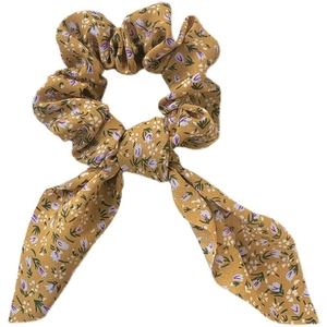 Eleganter gelber Blumen-Haargummi mit lila Mustern und langem Schleifendesign