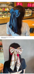 Vue détaillée d'une grande pince à cheveux à nœud floral avec de longs rubans