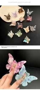 Detail showing colorful acetate butterfly hair claw clips with metallic spring