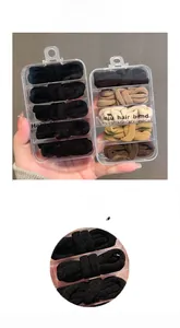 Macro detail of seamless high elasticity hair ties in earth tones 25-piece box set