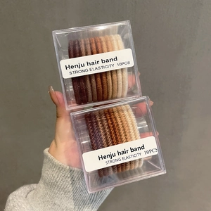 Set of 10 gradient brown high elasticity braided hair ties in a clear storage box